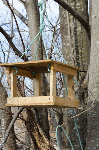 Bird feeder made from improvised materials. Preparing for the meeting of migratory birds.