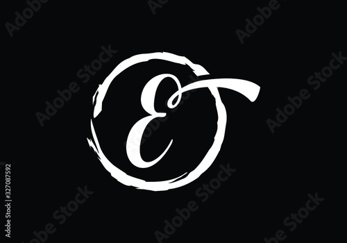Script letter E in a brush circle on black background, Monogram Calligraphy hand drawn alphabet initials and brush circle.