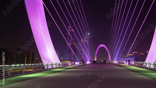 night time illuminated nanjing city famous padestrian eye bridge famous towers timelapse panorama 4k china photo