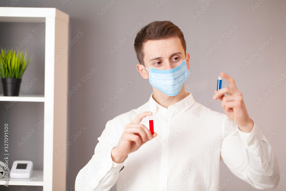 Young doctor holding test tubes with virus tests.