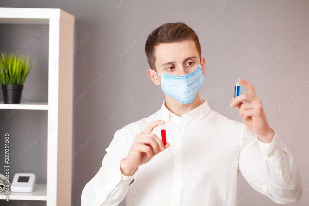 Young doctor holding test tubes with virus tests. Young doctor holding test tubes with virus tests.