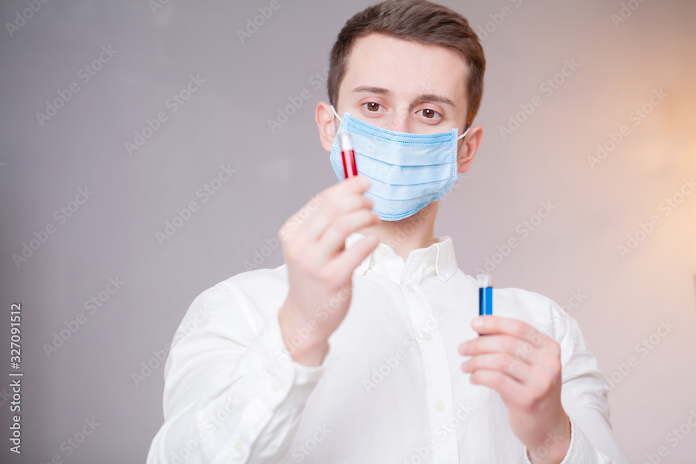 Young doctor holding test tubes with virus tests. Young doctor holding test tubes with virus tests.