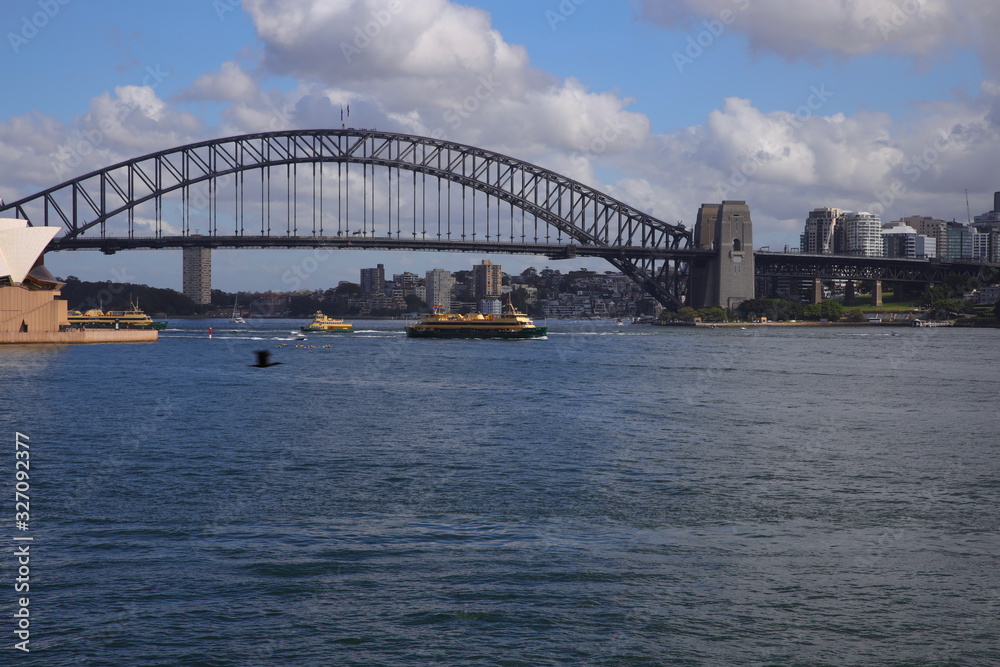 Sydney harbour from the botanical gardens with the harbour bridge and opera house in full view