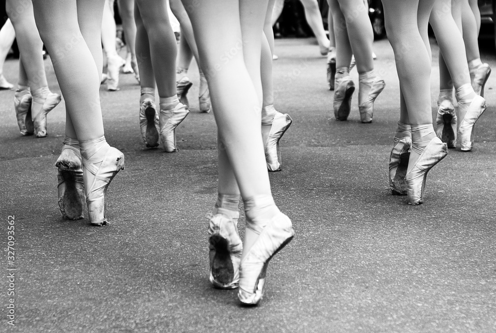 Classical ballerinas legs dancing on the street in ballet tip. Classical ballerinas legs dancing on the street in ballet tip.