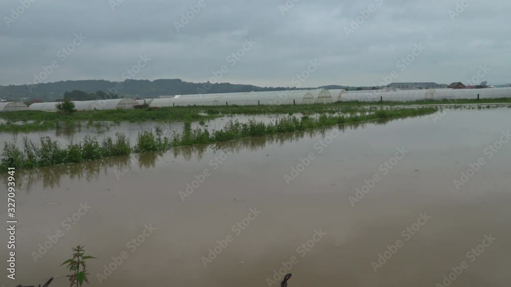 Village, trees and submerged in flood due to heavy rain causing heavy water flow Village, trees and submerged in flood due to heavy rain causing heavy water flow