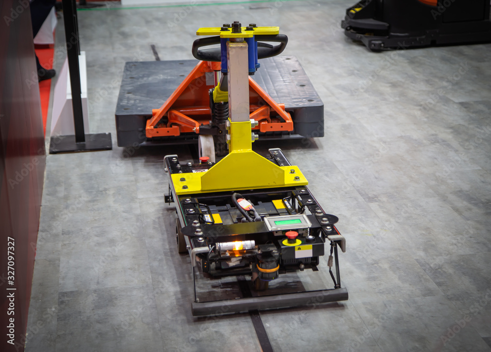 Forked Automated Guided Vehicles (AGV) handling material in warehouse
