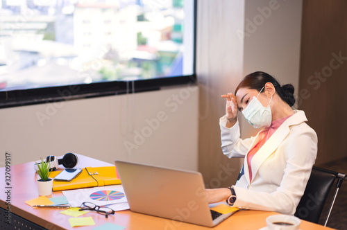 Working woman has fever during virus outbreak.