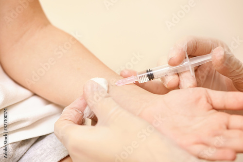 Doctor set injection to young pretty girl. Kid vaccine medical immunization. Cotton and syringe neat child arm. Medical hand. medicine pediatrician clinic. Sick baby