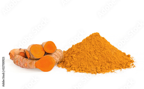 Turmeric (curcumin) rhizomes and powder isolate on a white background,Used for cooking and as herbal medicine,copy space.