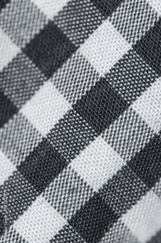 White and black checkered tablecloth, close-up