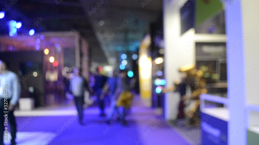 Blurred Background. People are standing behind counter in of purple hall. Blurred Background. People are standing behind counter in of purple hall.