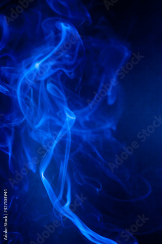Blue smoke motion on black background.