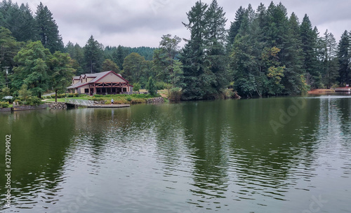 Wonderful Lacamas Lake on a breezy cloudy morning with the wilderness reflecting in the calm shimmering water in Camas Washington