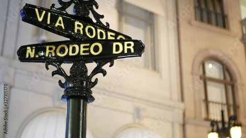 World famous Rodeo Drive symbol, Cross Street Sign, Intersection in Beverly Hills. Touristic Los Angeles, California, USA. Rich wealthy life consumerism, Luxury brands and high-class stores concept