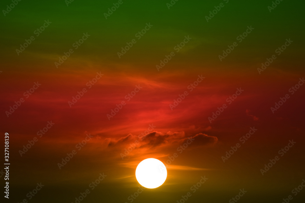 sunset on green red orange sky back soft evening cloud over space