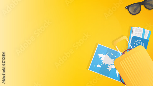 Yellow background with place for text. Yellow suitcase, world map, sun glasses, passport and tickets. Background for the theme of leisure and tourism. 
