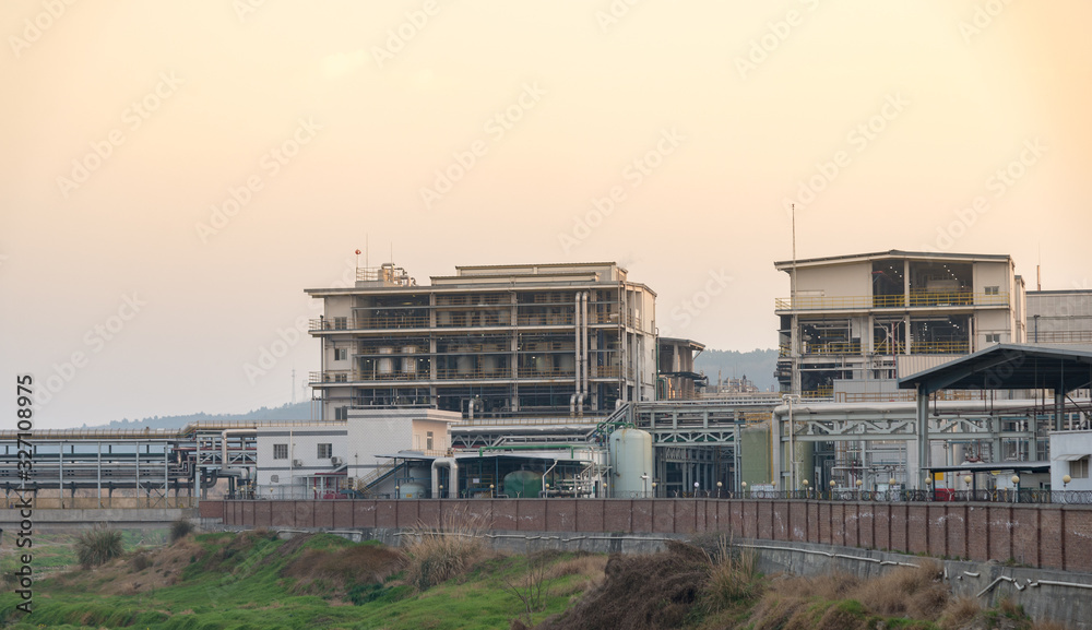 modern chemical plant at sunset