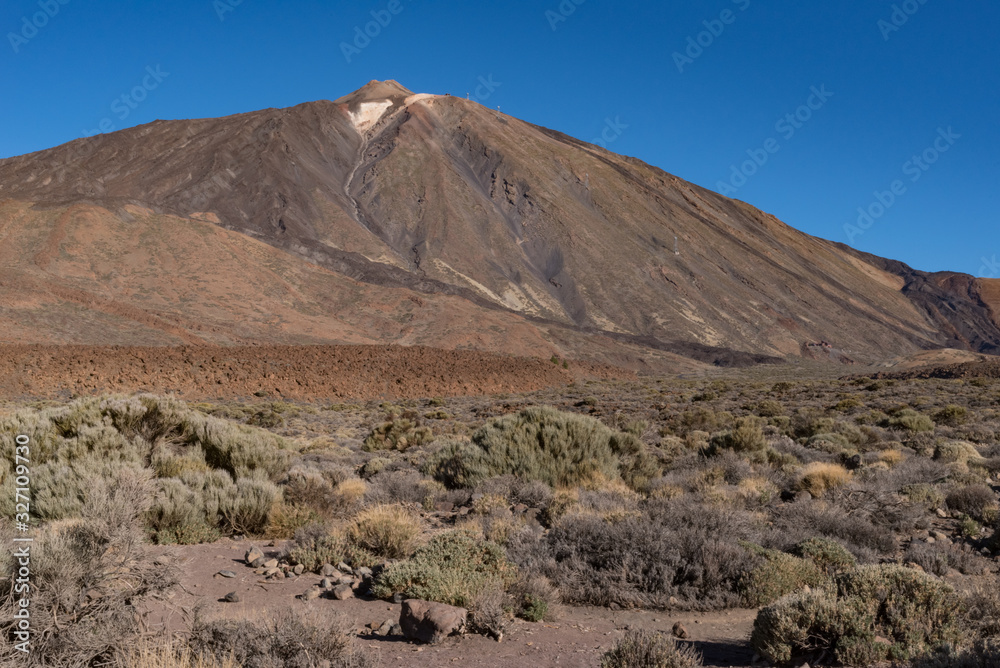 Pico del Teide mountain volcano summit view form lava field near Roques de García unique rock formation, Teide National Park, Tenerife, Canary Islands, Spain