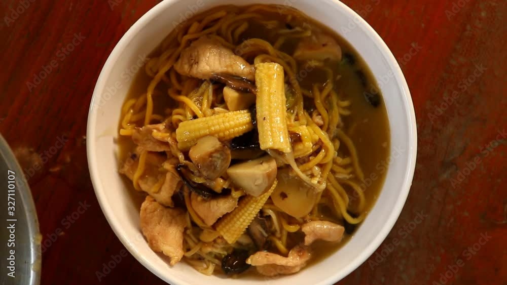 Yellow noodles  in  bowl , Thai or Chinese food