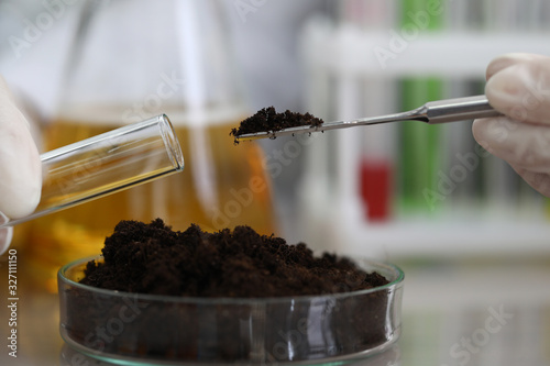 Soil sampling for chemical analysis and ph test. Agrochemical analysis soil and greenhouse soil for fertility. Assessment soil contamination with toxic substances. Selection fertilizers photo