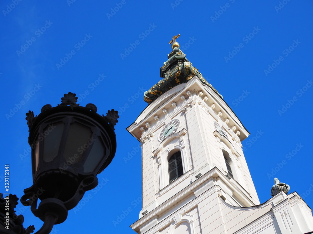 church tower in sunshine against blue sky