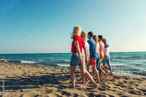 Enjoying a walk on the beach with friends