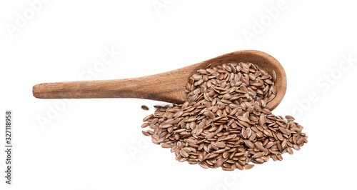 Canvastavla Side view of linseeds or flax seed on a tilted brown wooden spoon with spill and
