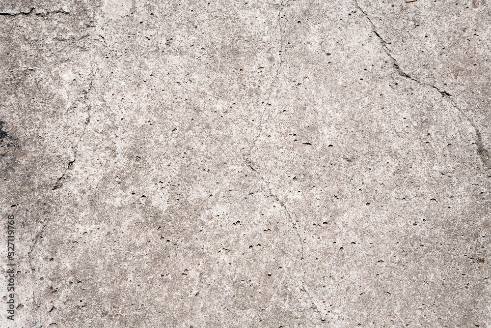 Close up shot of grey stone surface with cracks and potholes. Natural Wallpaper, Texture, Pattern, Backgrounds. Close up shot of grey stone surface with cracks and potholes. Natural Wallpaper, Texture, Pattern, Backgrounds.