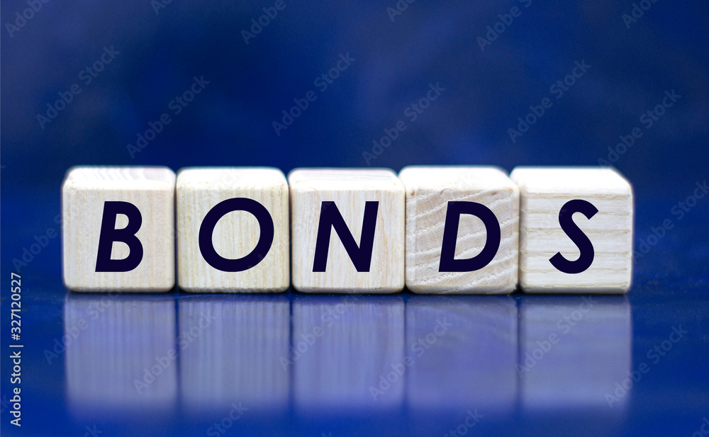 concept word bonds on cubes on a blue background concept word bonds on cubes on a blue background
