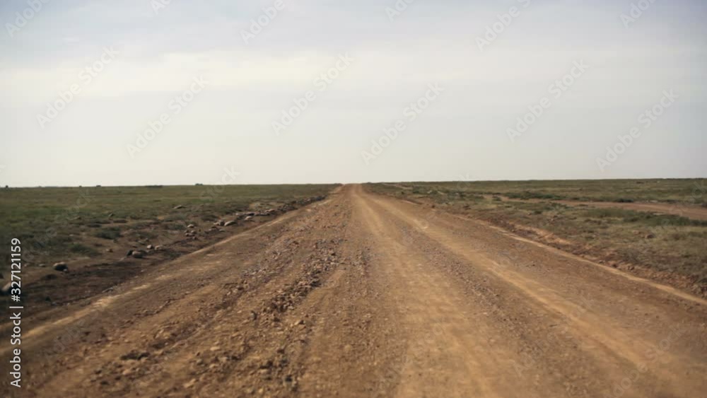 Dirt road to nowhere leads to horizon, Samburu, Kenya, Africa Dirt road to nowhere leads to horizon, Samburu, Kenya, Africa