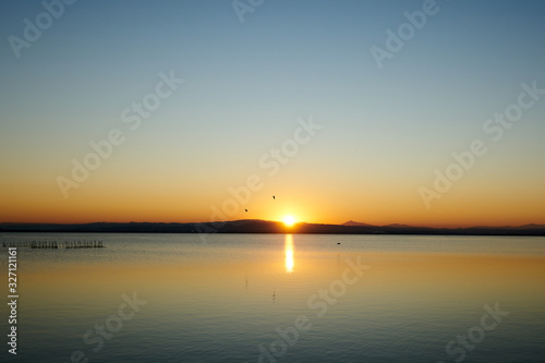 orange sunset on a lake 