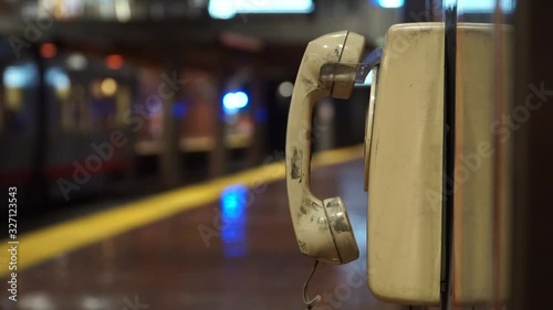 An old phone in a metro station