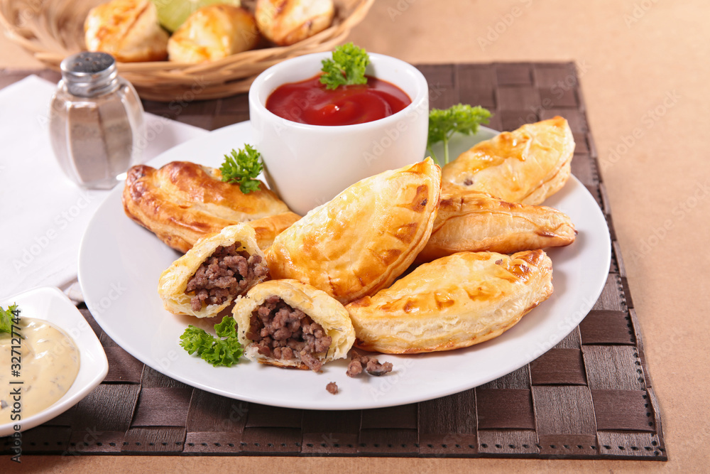 empenada with minced beef and tomato sauce empenada with minced beef and tomato sauce