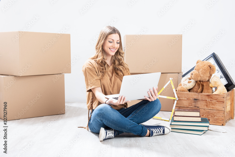New apartment dream with woman using a laptop New apartment dream with woman using a laptop