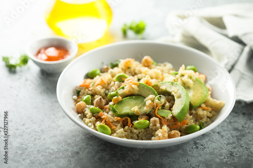 Healthy quinoa bowl with soy beans and avocado