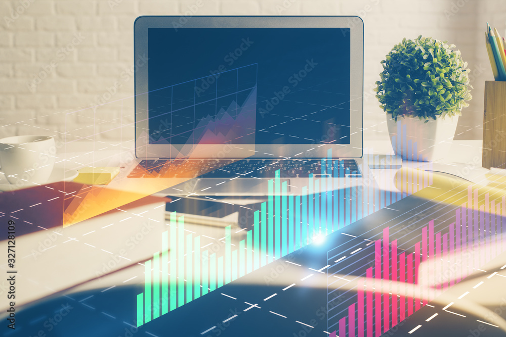 Stock market chart hologram drawn on personal computer background. Multi exposure. Concept of investment. Stock market chart hologram drawn on personal computer background. Multi exposure. Concept of investment.