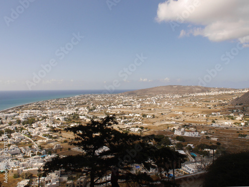 Panoramic view of the village of Perissa on Santorini island, from the top of the mountain. Aerial view of the Mediterranean Sea and beaches. © Mizikevitch