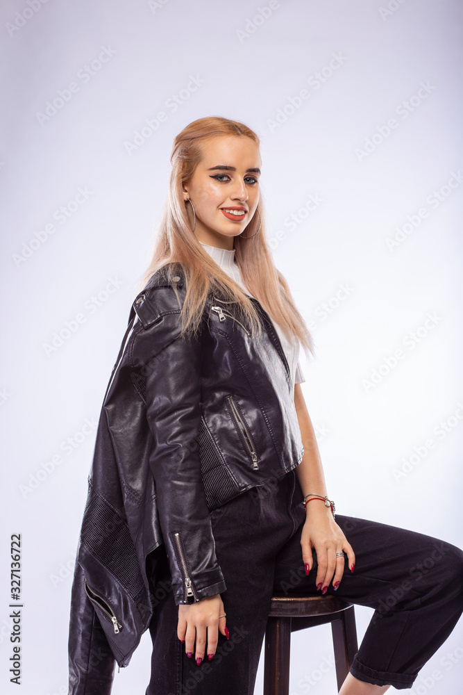 Young fashionable blonde woman in black leather jacket Young fashionable blonde woman in black leather jacket