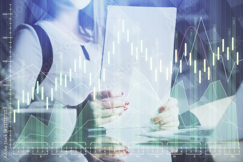 Wallpaper Mural Double exposure of hands making notes with forex chart huds. Stock market concept. Torontodigital.ca
