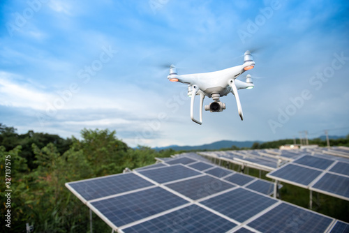 Drones and solar cells, The drone is a high angle camera shooting a solar cell farm. Which is clean energy Able to generate electricity photo