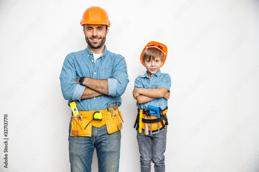 Merry father and son with hand instruments stock photo Merry father and son with hand instruments stock photo