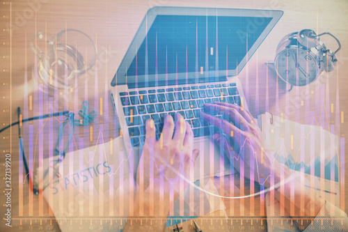Multi exposure of forex graph with man working on computer on background. Concept of market analysis. © peshkova