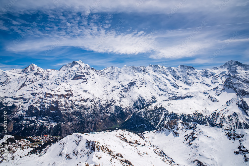 Panoramic view of famous peaks Monch, Jungfrau, Gletscherhorn, Grosshorn and Breithorn in Swiss Alps, Switzerland