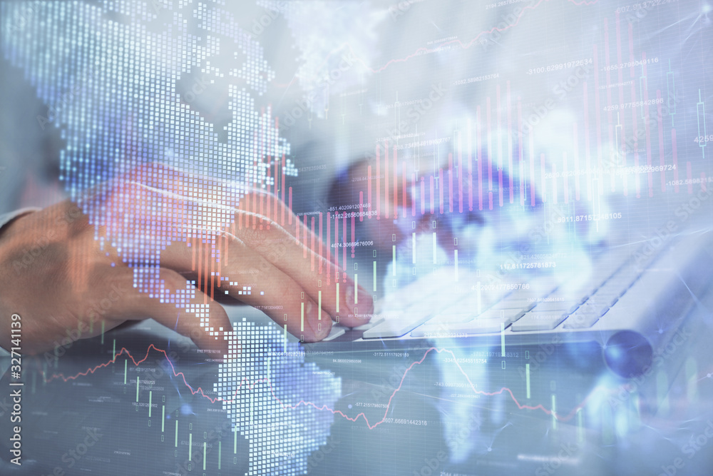 Double exposure of graph with man typing on computer in office on background. Concept of hard work. Double exposure of graph with man typing on computer in office on background. Concept of hard work.