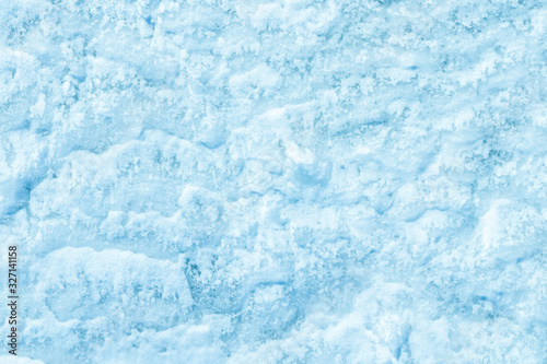 blue texture of an snow surface with pure white wave , blue cold clear cryslallized wall background ,decorative plaster background close up , abstract macro wallpaper