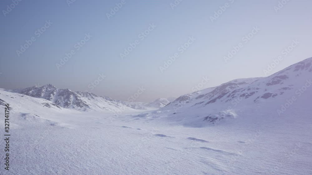 Aerial Landscape of snowy mountains and icy shores in Antarctica Aerial Landscape of snowy mountains and icy shores in Antarctica