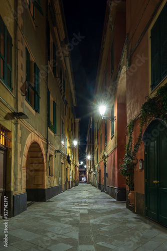 Night view of Alassio narrow street, Italian Riviera