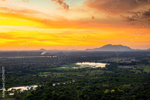 Sunset over the forest and mountains in Sigiriya, Sri Lanka