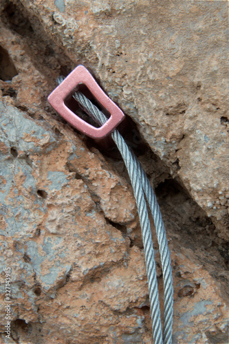 Rock climbing nut placed on crack 