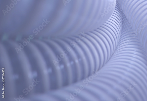 Curved crimped white tubes background